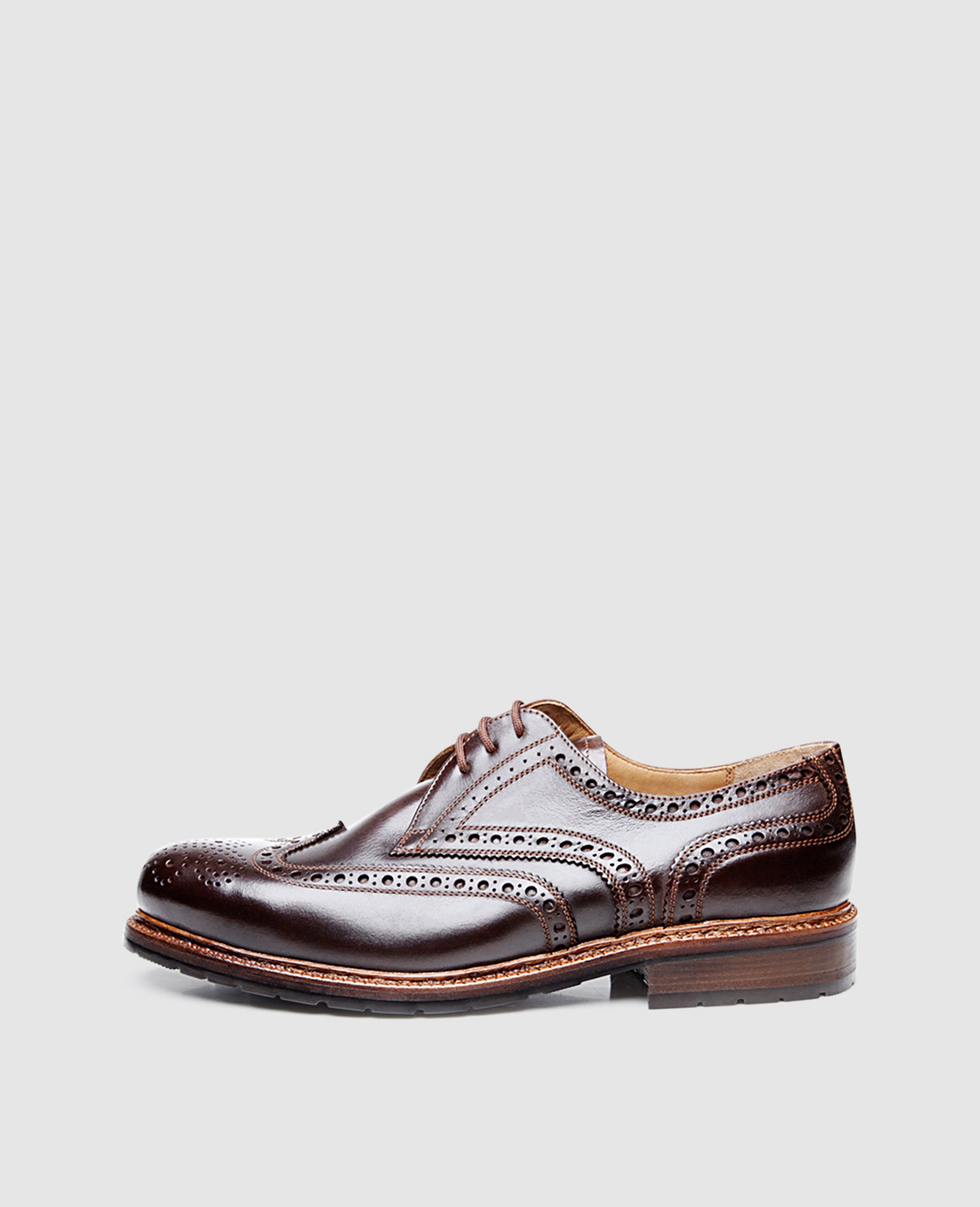 bonheur Handcrafted full brogue men's shoe with rubber profile sole